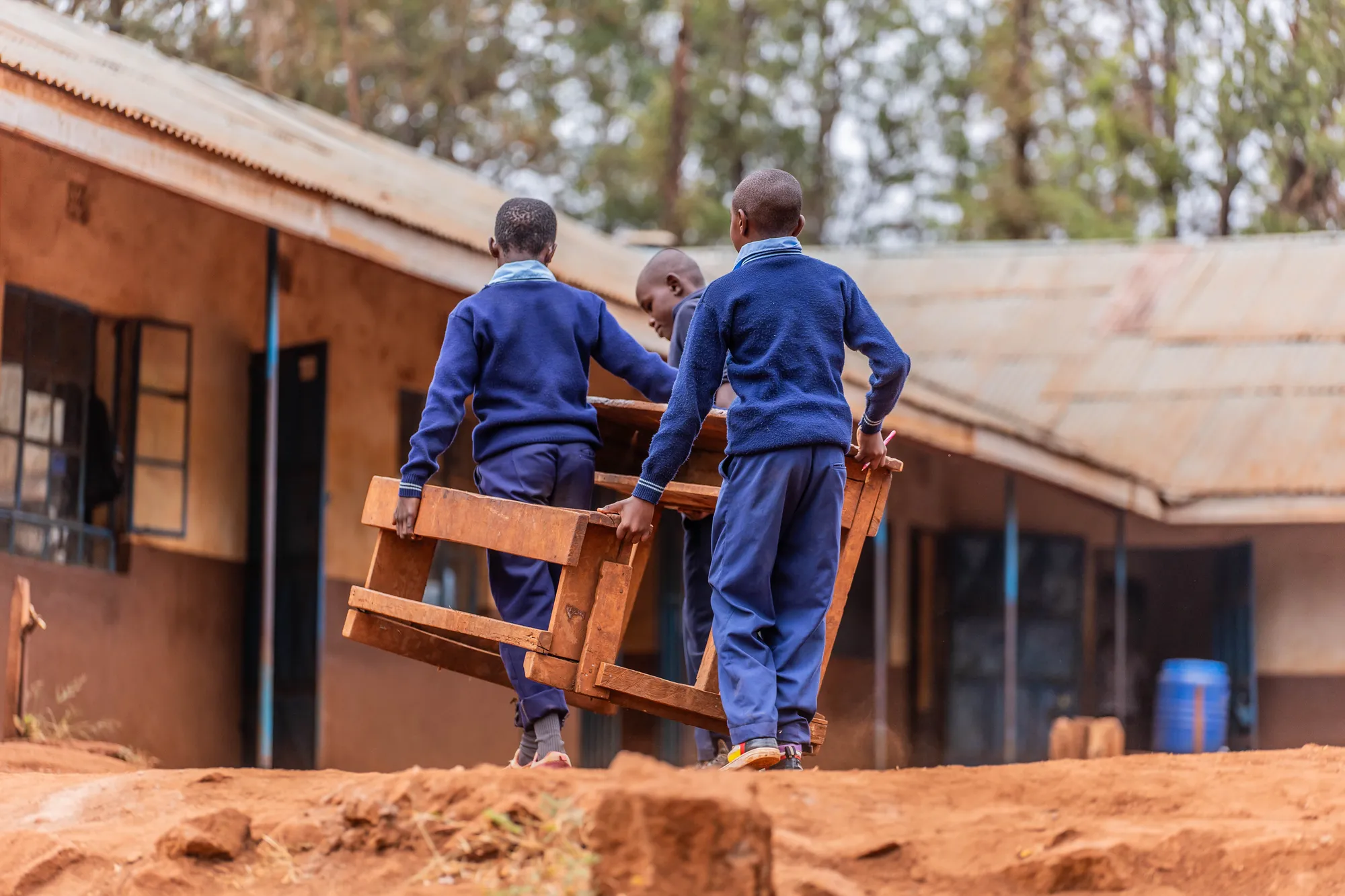 Two children running on a field